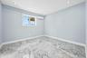 Unfurnished room featuring recessed lighting and an AC wall unit
