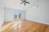 Spare room with french doors, a ceiling fan, light wood-type flooring, recessed lighting, and a wall mounted air conditioner