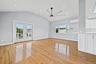 Unfurnished living room with recessed lighting, light wood finished floors, lofted ceiling, french doors, and a ceiling fan