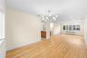 FORMAL LIVING ROOM OPEN TO THE DINING ROOM AND KITCHEN