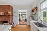 Kitchen opens to screened in porch