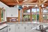 Open to the living room with stunning farm views and beyond