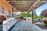 Hosting a pool party is a breeze with the expansive outdoor cookout space