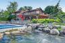 One of 3 koi ponds on the property bring a resort feel to the pool deck