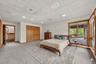 One of two bedrooms on the lower level with direct access to the pool deck*virtually staged*