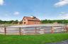 4 board fencing surrounds the oval shaped stone dust ring