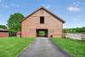 The classic main barn has easy access to the stone dust ring, and the large loft holds plenty of bales