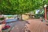 The side deck is canopied by a wonderful weeping birch tree, providing shade and an artistic backdrop