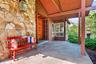 Wood, slate and stone entrance contribute to the rustic vibe