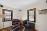 Hardwood flooring complemented by light-toned wall finishes and ceiling