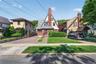 Distinctive architectural character featuring a brick facade with a slate roof