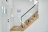 Entrance foyer featuring stairway and wood finished floors