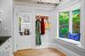 Doorway to outside with wood finished floors and a wood ceiling with exposed beams