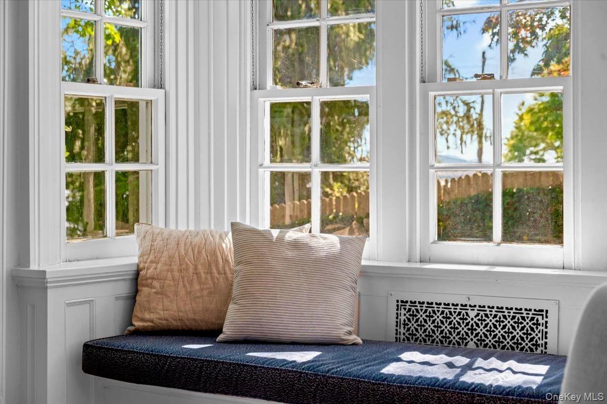 Sunroom with radiator heating unit and healthy amount of natural light