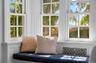 Sunroom with radiator heating unit and healthy amount of natural light