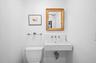 Half bathroom with toilet and a sink