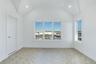 Spare room with lofted ceiling and recessed lighting