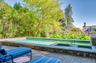 View of swimming pool featuring an in-ground hot tub, a patio area, and a swimming pool