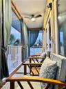 Balcony on Apt Entry. Covered in curtains.