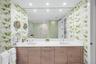 Vanity and sink in primary en suite bathroom