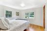 Plenty of natural light and privacy in the guest bedroom.