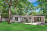The spacious backyard offers room for summer barbecues, lawn games, evenings around a fire pit, or simply relaxing beneath the stars.
