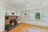 Spacious living room with charming fireplace.