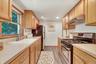 Bright eat in kitchen offering ample cabinetry and move in ready.