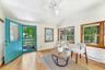 Welcoming entry opens to a bright, light filled interior with hardwood floors and effortless flow throughout.