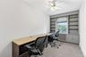 Bedroom #2 used as an office with Built-Ins and Closet with Custom Shelving