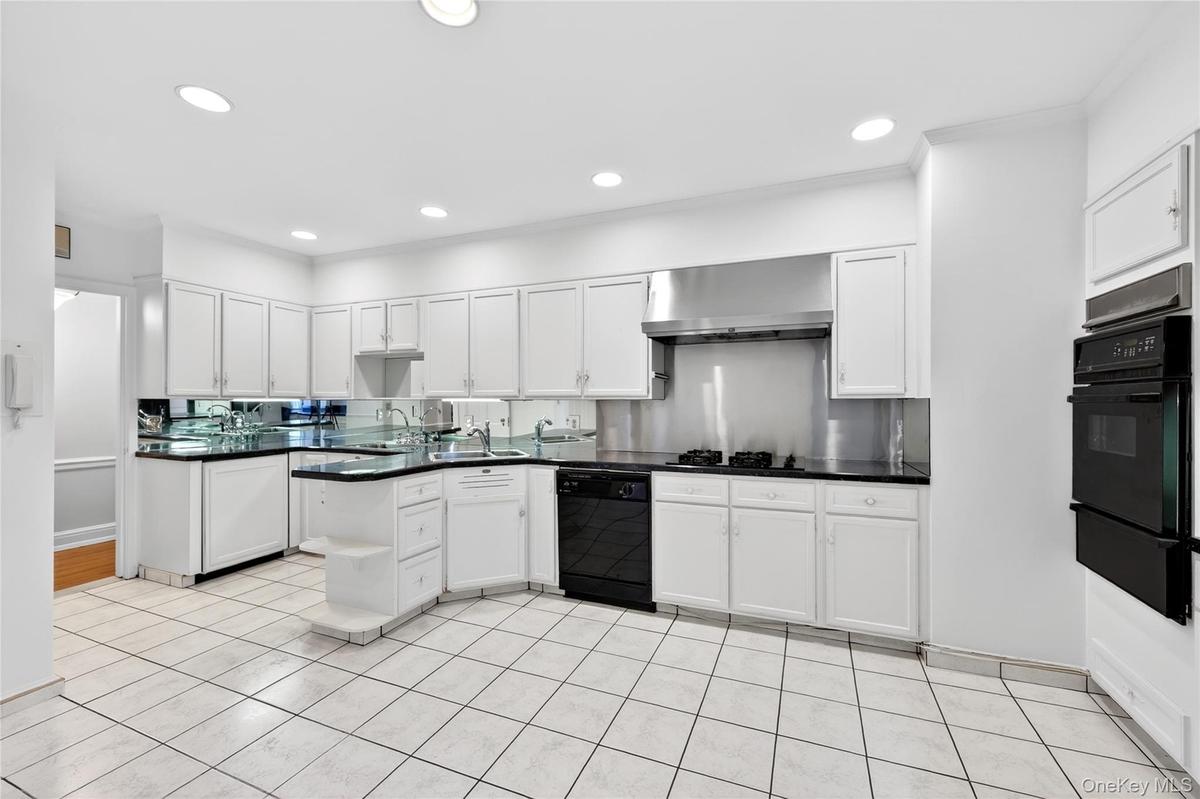 Eat-In Kitchen with Ample Storage and a dedicated Prep area with its own sink and fridge