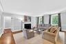 The Living Room offers generous space with a wood burning fireplace