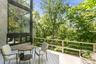 A spacious deck overlooks acres of peaceful reservoir land, offering a rare sense of privacy and natural beauty. Enjoy quiet mornings, outdoor dining,