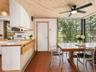 Open Kitchen to Breakfast area with floor to ceiling windows with tons of natural light