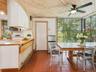 Open Kitchen to Breakfast area with floor to ceiling windows with tons of natural light
