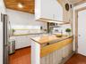Open Kitchen to Breakfast area with floor to ceiling windows with tons of natural light