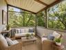 A charming 3-season room extends the living space and offers serene views of the surrounding wooded acreage. Tucked away with exceptional privacy, thi
