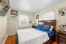 Wood-finish flooring and light-toned walls create a neutral backdrop for the room