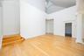 Primary Bedroom with staircase to loft