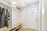 New Mudroom with Custom Bench/Shelving with Access to Attached Garage