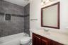 Bathroom – Tub/Shower ComboUpdated bathroom with tile surround and modern finishes.