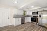 Functional kitchen layout with generous storage and workspace for daily living.