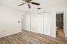 Bedroom featuring built-in storage and closet system for added organization.
