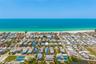 Aerial – Full Island PerspectiveAerial view showcasing the home’s prime location between Sarasota Bay and the Gulf of Mexico.