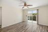 Living Area – Wide Open ViewSpacious open-concept living area with durable flooring and flexible layout for everyday living or entertaining.Sliding gl