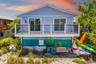 Rear Exterior (Twilight Feel)Elevated home with spacious deck and inviting outdoor living areas—perfect for enjoying island evenings.