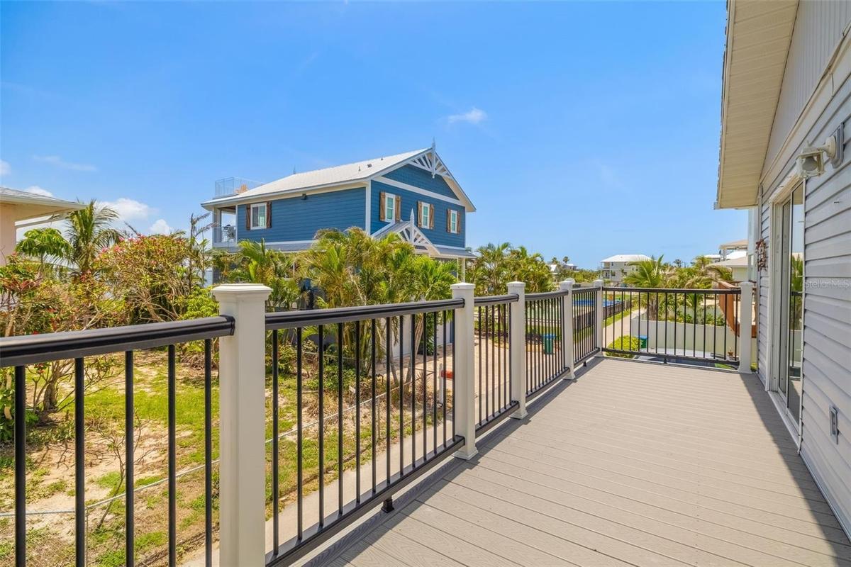 Private elevated deck ideal for outdoor dining, relaxing, and enjoying coastal breezes year-round.Generous outdoor deck space perfect for entertaining