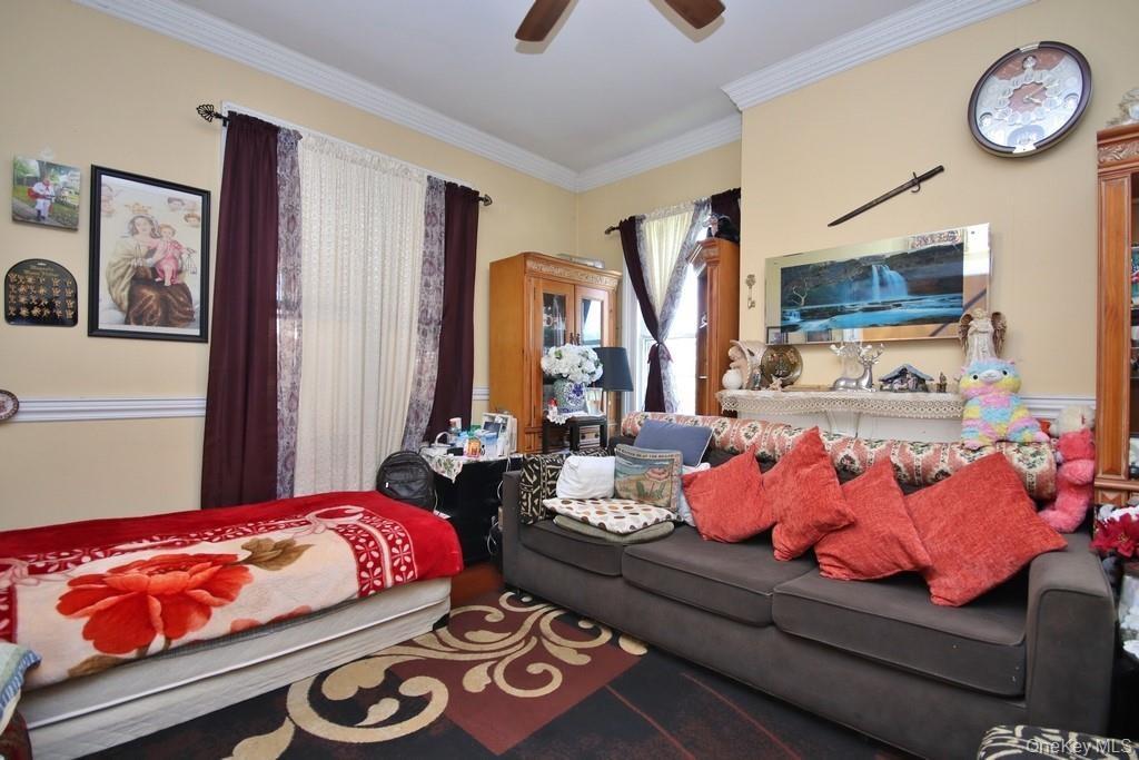 Living Room has ceiling fan with light