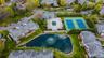 Aerial perspective showcasing a residential community with a central amenity area