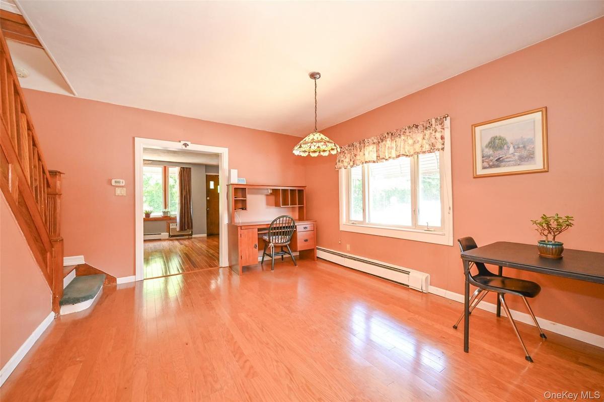 Dining room featuring pre-engineered hardwood.